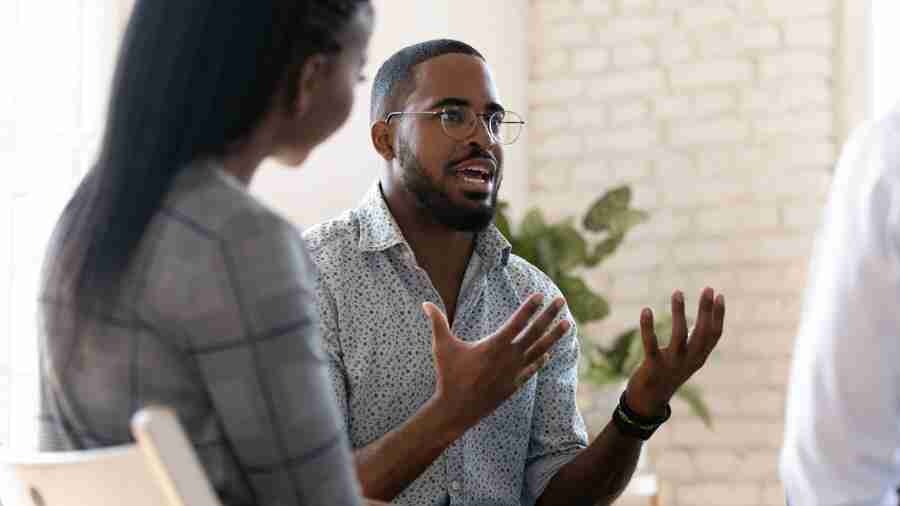 a man speaking during group therapy for addiction treatment