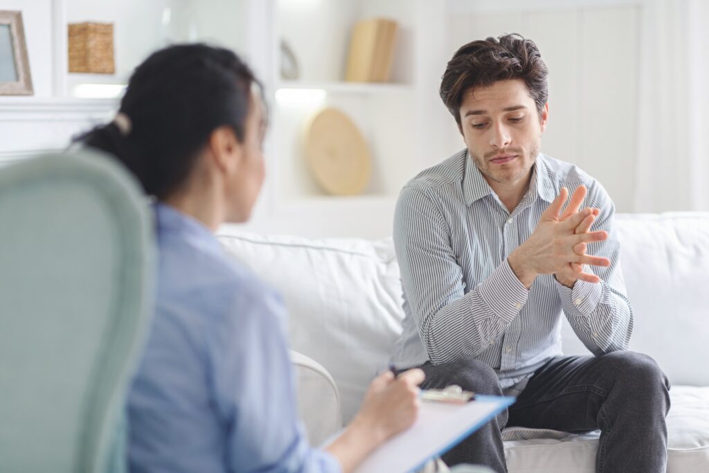 Individual receiving guidance during a therapy session about the effects of alcohol on blood