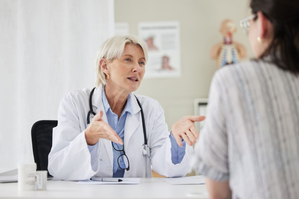 Healthcare professional discussing Adderall use, detection times, and treatment options with a patient.