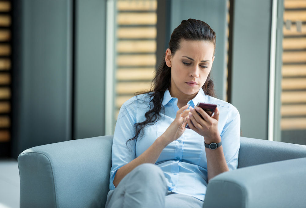 Future rehab patient contacting a treatment center to confirm packing requirements and admission policies.