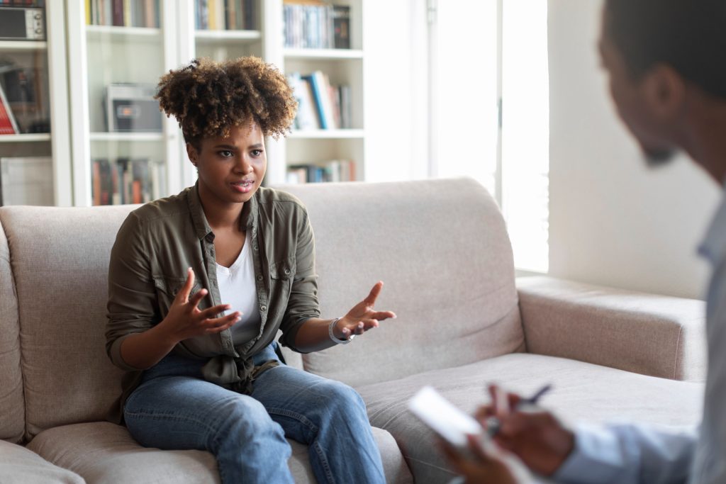 person discussing affordable addiction treatment options with a rehab admissions specialist