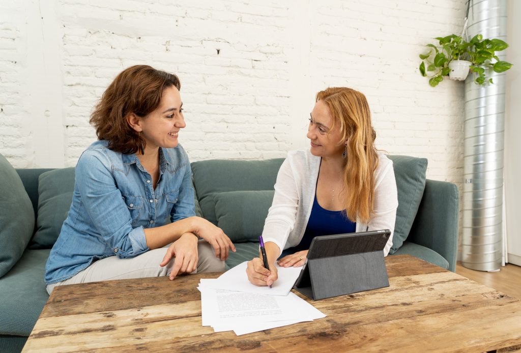 Person discussing treatment options with a counselor while choosing between inpatient and outpatient rehab programs